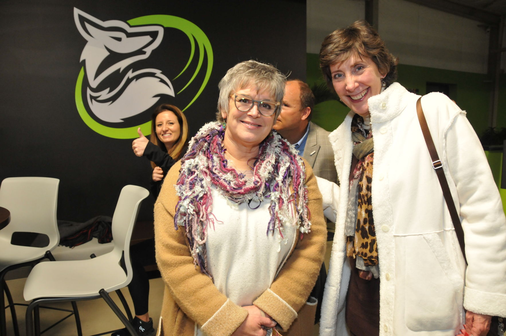 Julie Kubsch and Julie Payne being photobombed by Erin Williams and Charlie Moore